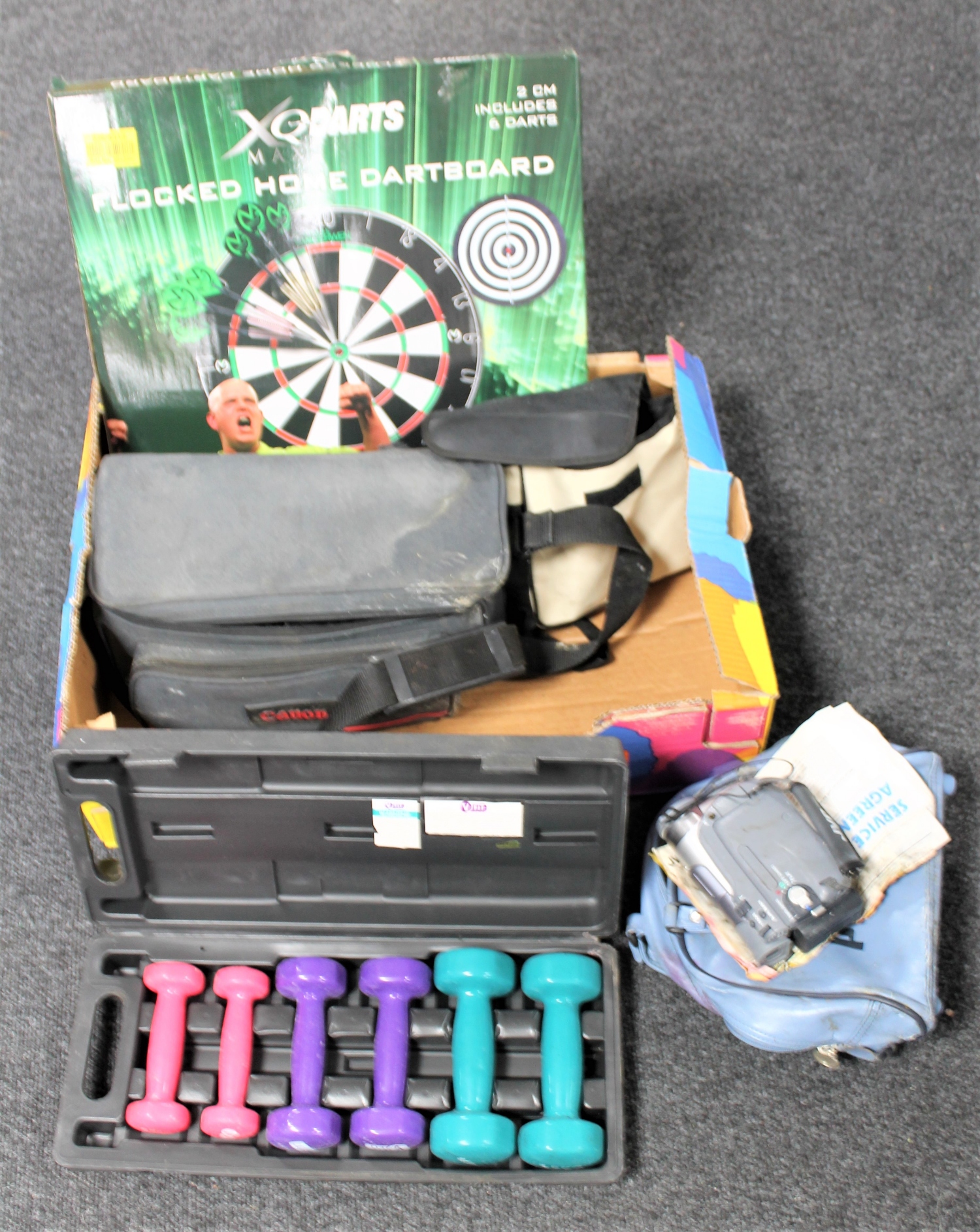 A box of cased camcorders, boxed dart board, pair of binoculars (a/f),