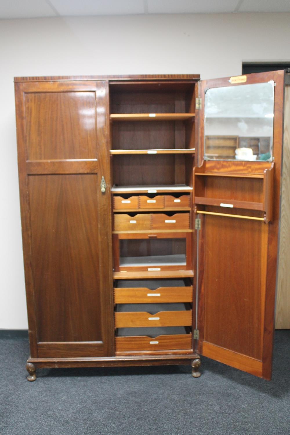 An Edwardian mahogany Verithing gentleman's compactum wardrobe CONDITION REPORT: