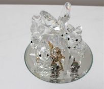 Four Swarovski crystal figures on mirrored stand to included Butterfly, Squirrel,