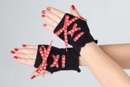 A box of 144 pairs of lady's skull gloves with red laces