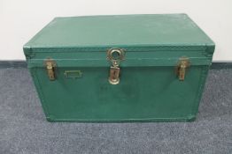 An early 20th century painted metal bound shipping trunk