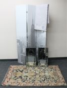 A three-fold screen depicting New York skyline together with two metal framed mirrors,
