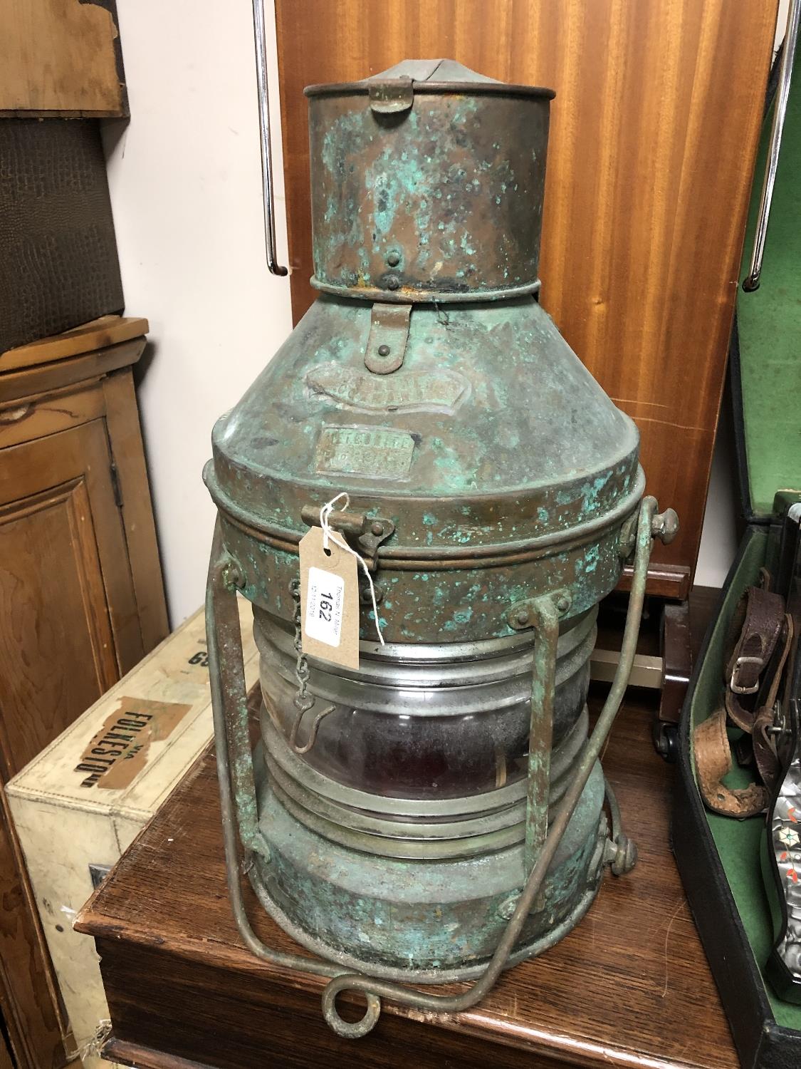 A vintage brass meteorite ship's lamp