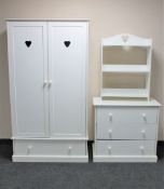 A contemporary white double door wardrobe fitted a drawer with matching three drawer chest and open