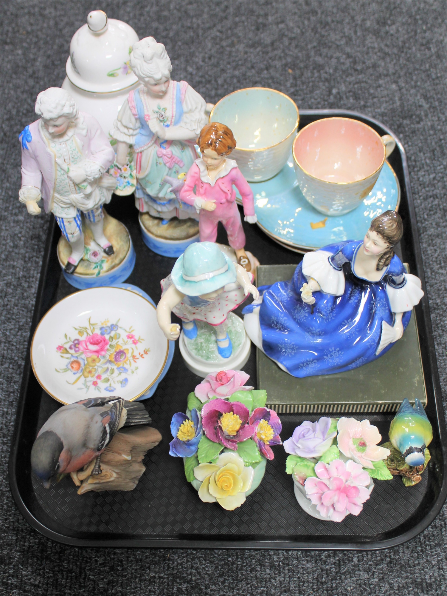 A tray of Maling cups and saucers, pair of bisque figures, two Royal Worcester figures (a/f),