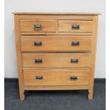 An Edwardian pine five drawer chest