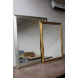 A large silvered framed mirror and a gilt framed mirror