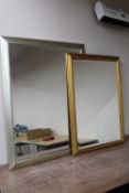 A large silvered framed mirror and a gilt framed mirror