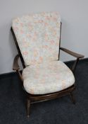 A mid 20th century teak framed armchair