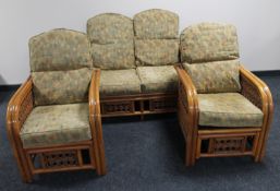 A three piece bamboo and wicker conservatory suite