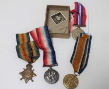 Three WWI medals on ribbons awarded to 6174 Corporal T.