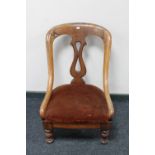 A Victorian mahogany nursing chair