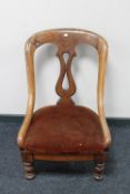 A Victorian mahogany nursing chair