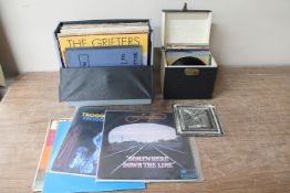 A case of 7" singles : Sex Pistols etc, case of LP records : Tram Line, Troggs,