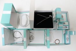 A box of silver jewellery, rings, earrings, bracelets,