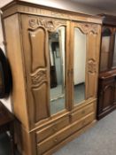 A Victorian satin walnut double door mirrored wardrobe,
