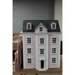 A Georgian style doll's house and a part flat pack doll's house