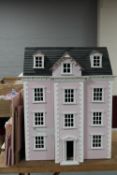 A Georgian style doll's house and a part flat pack doll's house