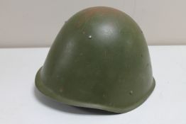 A Warsaw Pact steel military helmet