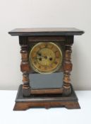 An antique pine cased mantel clock