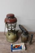 A Tilley lamp together with a vintage brass blow torch and a boxed Day's Gone die cast traction