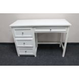 A contemporary four drawer dressing table