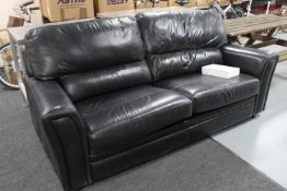 A black leather bed settee