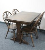 An Ercol extending dining table and four chairs