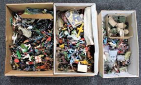Three boxes of painted and un-painted mid twentieth century metal and plastic soldiers,