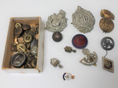 A box of military badges and buttons,