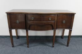 A Georgian style mahogany serpentine fronted sideboard