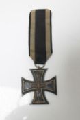 A German WWI Iron Cross with ribbon