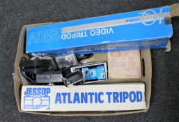 A box of two camera tripods and assorted cameras