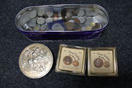 A tin of pre decimal coins, foreign coins, two penny farthing coin sets,