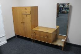 A mid 20th century Meredew Furniture gentleman's wardrobe and dressing chest