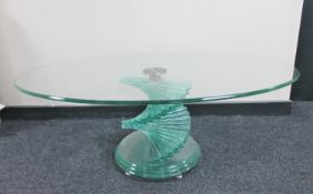 A circa 1970's Italian oval glass coffee table on twist pedestal