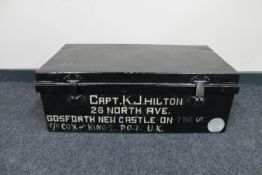 An early 20th century tin trunk named to Captain K.J.