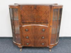 A 1930's walnut side by side bureau display cabinet