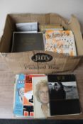 A box of sheet music and song books