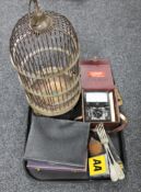 A tray of metal bird cage, cased cutlery, vintage AA badge,