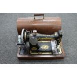 A cased vintage Singer sewing machine