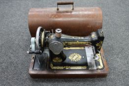 A cased vintage Singer sewing machine