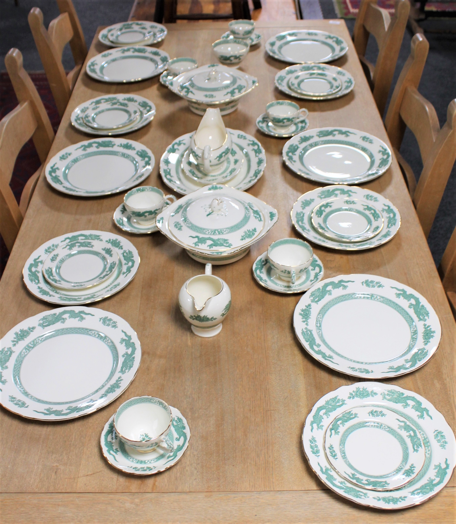 Approximately thirty-six Royal Cauldron green Chinese dragon pattern dinner service