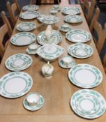 Approximately thirty-six Royal Cauldron green Chinese dragon pattern dinner service