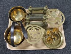 A tray of brass jam pans, trivet,