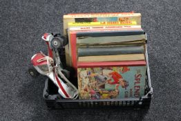 A crate of a pair of vintage roller skates, annual including Bunty for Girls,