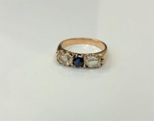 An antique 18ct gold sapphire and diamond three stone ring,