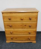 A pine four drawer chest