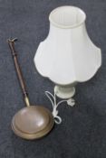 A wooden handled copper bed warming pan together with a Denby table lamp with shade by Allen