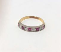 An 18ct gold ruby and diamond half eternity ring,